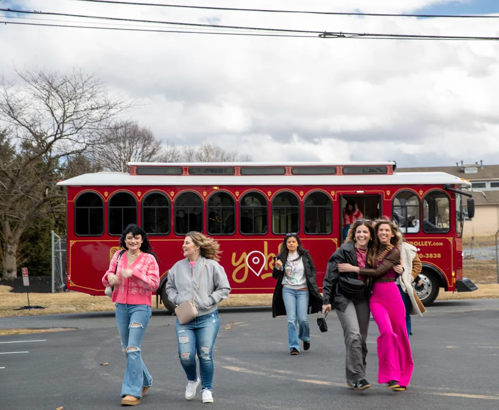 Guests stepping off the red Yokl trolley in Hershey, PA